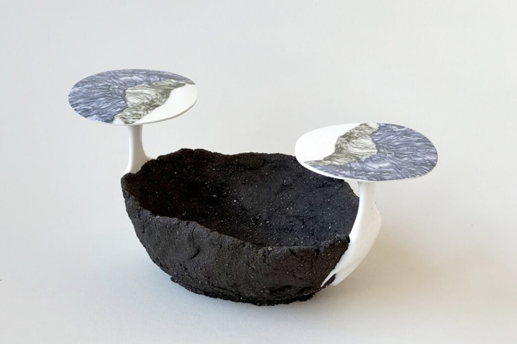 ESTELLE GASSMANN 'Unfolding' 2024 Black clay, glaze/porcelain/pigments, decals after original photograph/digital print 12 x 22.5 x 10 cm  (4 3/4 x 8 7/8 x 3 7/8 in.)