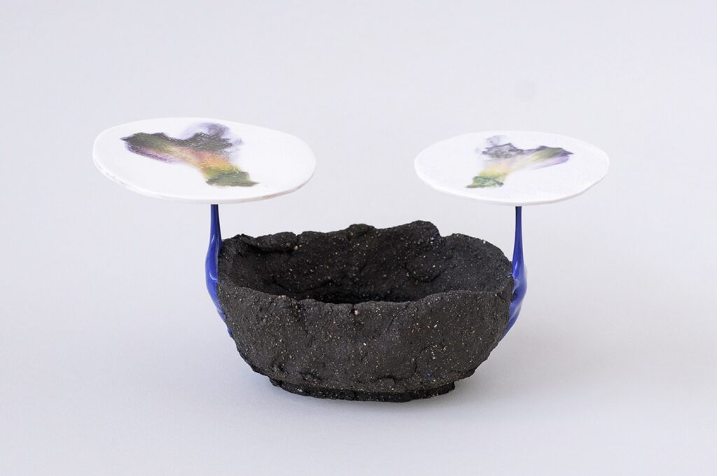 ESTELLE GASSMANN 'Vio' 2024 Black clay, glaze/porcelain/pigments,  decals after original photograph/digital print 11.5 x 22 x 10 cm  (4 1/2 x 8 5/8 x 3 7/8 in.)